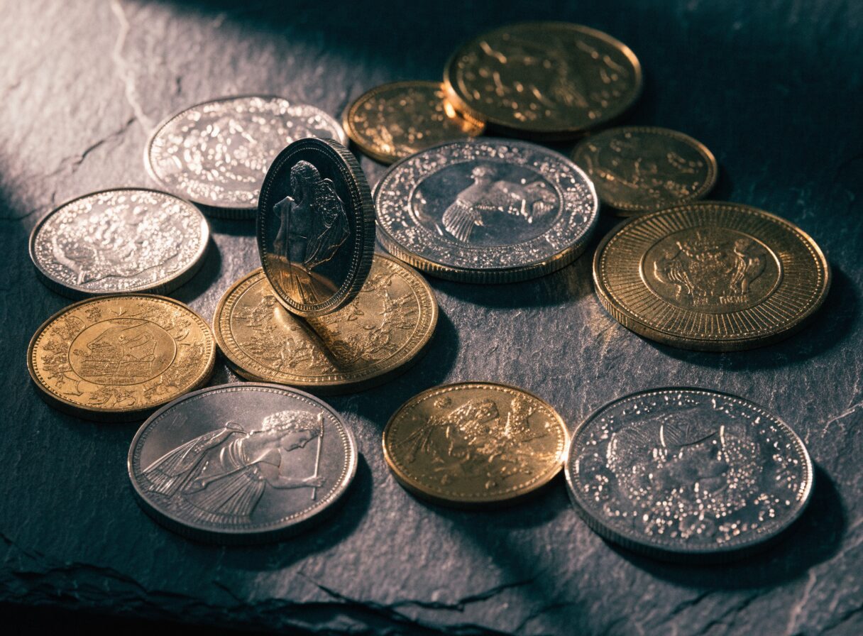 Silver and gold collector coins, representative of the coins and bills we handle